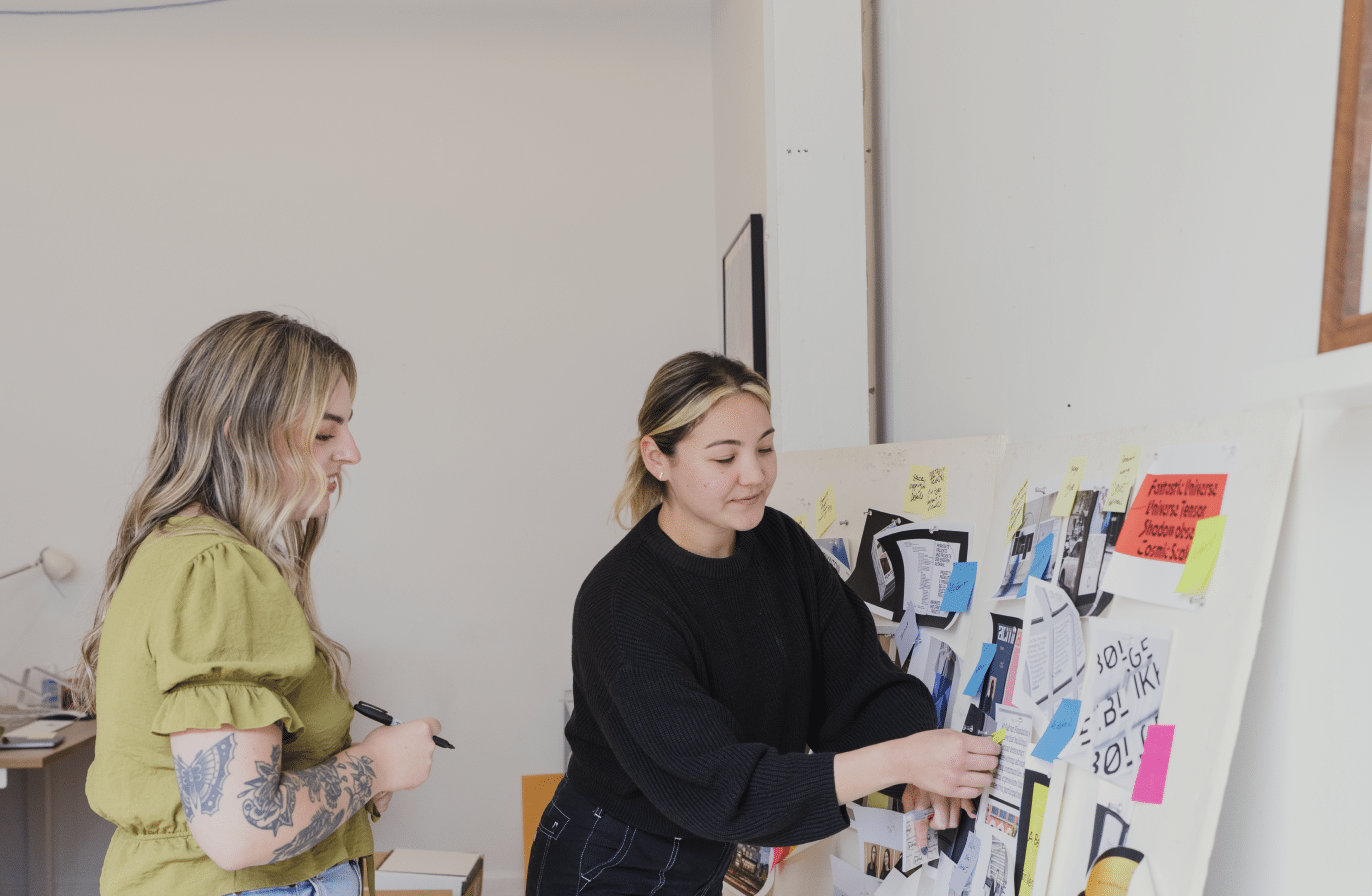 Designers Stephanie and Sara at pin up mood boards